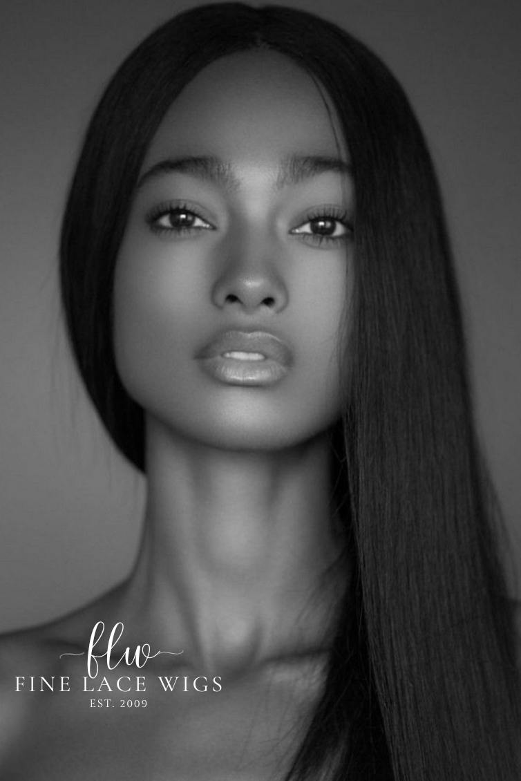 African American model wearing a natural-looking, high-quality straight dark brown human hair wig with a middle part. Available in various lengths, colors, and sizes